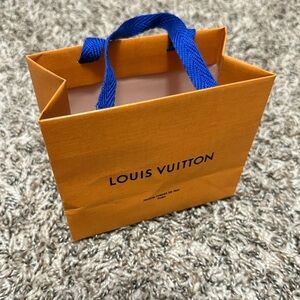 Louis Vuitton Vibrant Orange Bag with Bold Blue Handles